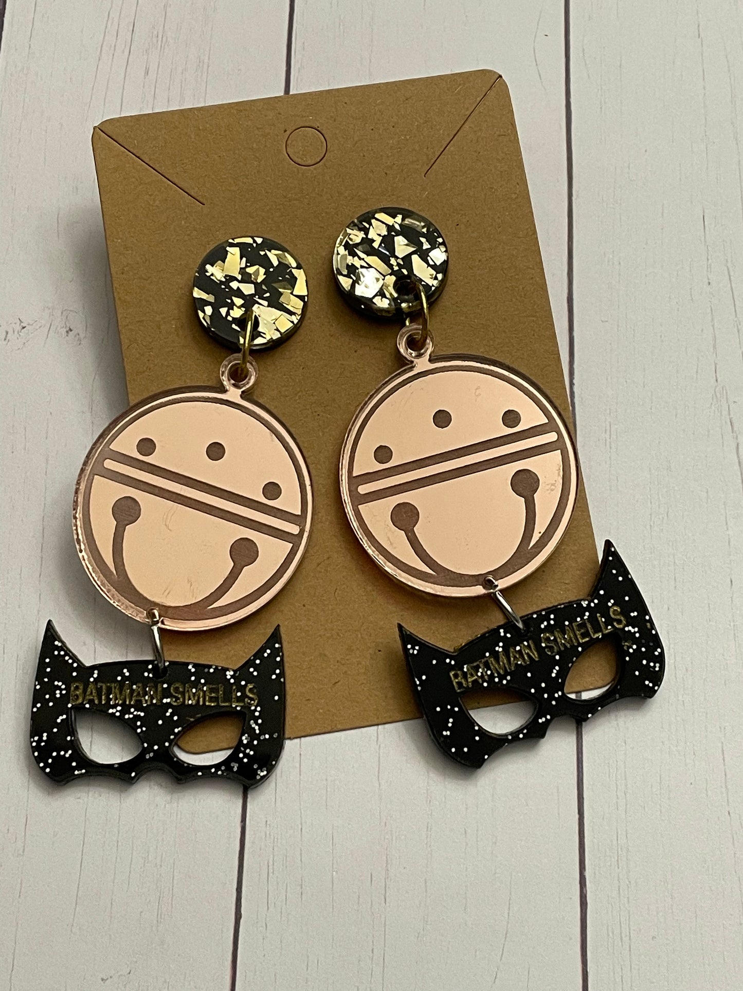 Jingle Bells Batman smells earrings