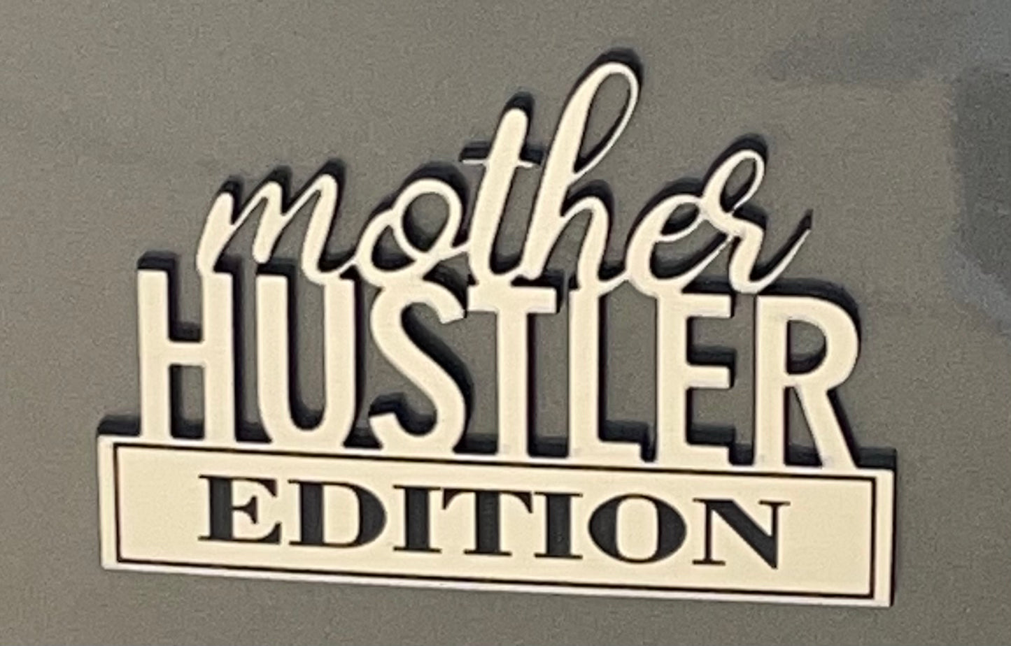 Mother hustler car emblem